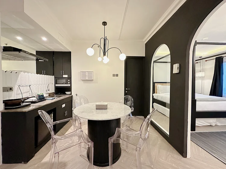 Los Angeles: The dining area connects to the bedroom through an archway, a signature Los Angeles touch.
