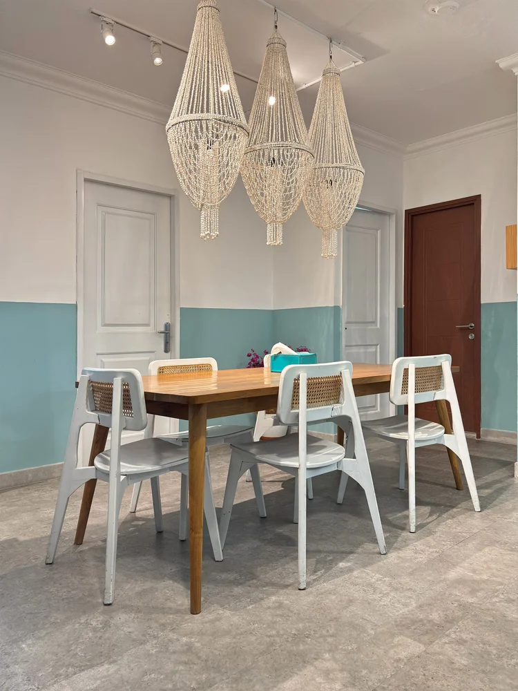 Mykonos: Macrame pendant lamps over the dining table, the bedroom doors all around.