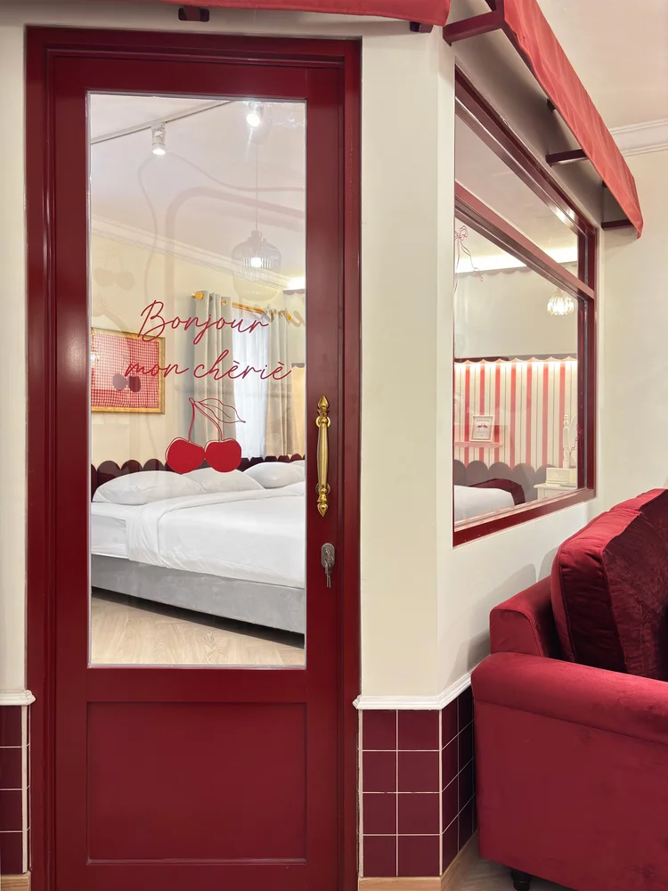 Chamonix: The red door between the bedroom and the living room's red sofa.