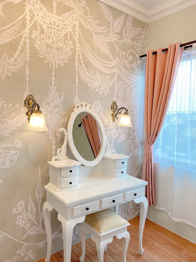 Malacca: A classic white dressing table, with a window beside it.