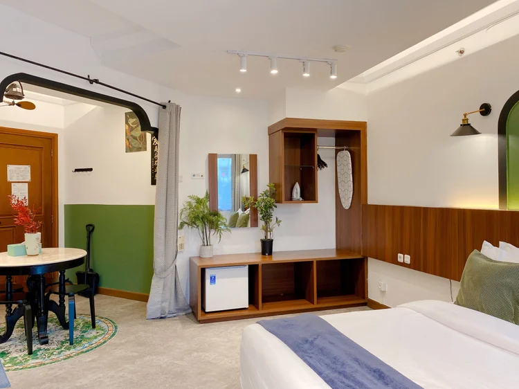 Saigon: Sleeps four; the open wardrobe and dining table share the same side of the room.