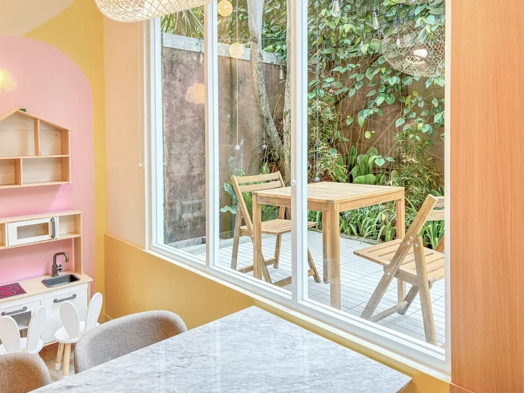 Gangnam: A small patio with an outdoor table and chairs, right off the living room.