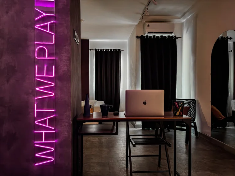 Copenhagen: A work desk beneath the neon wall sign, enough for working from the room.