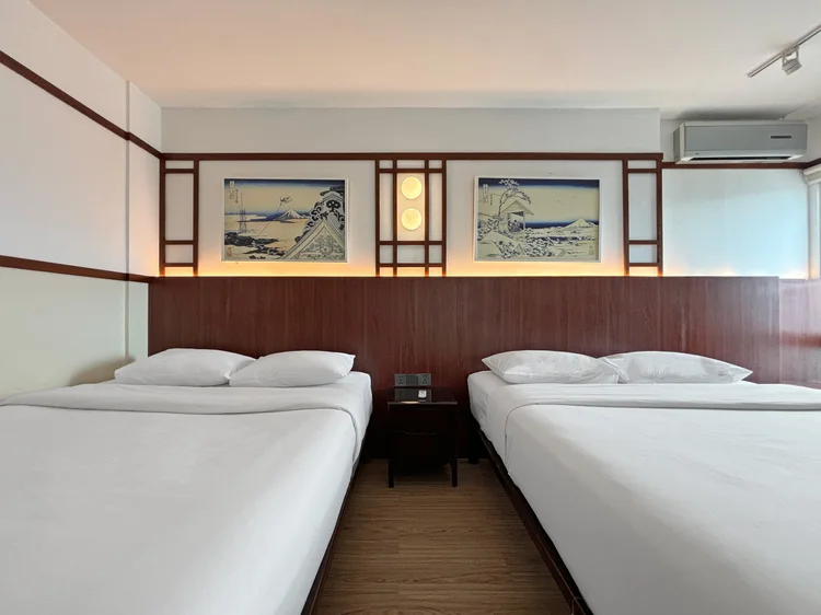 Okinawa: A bedroom with two queen beds side by side, four people in one room.