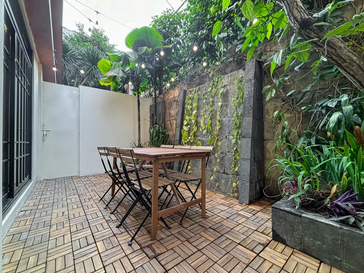 Shizuoka: An outdoor patio with a table for six, surrounded by plants.